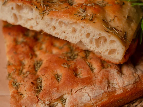 Rosemary focaccia with golden crust and dark herbs