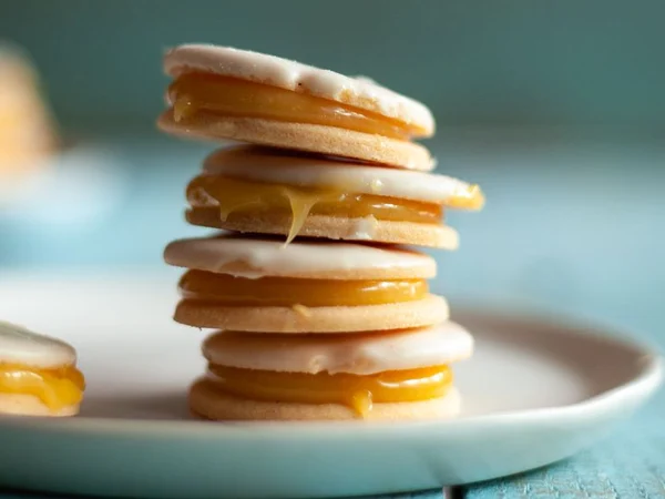 Alfajores with golden cookie edges and pale filling
