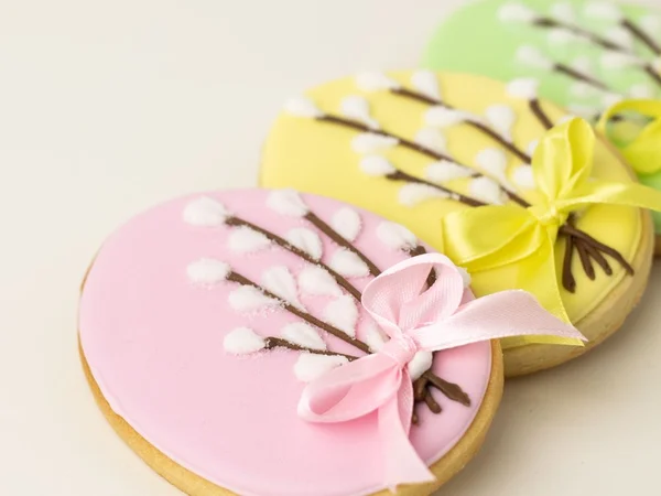 Sugar cookies with yellow, cream and pink decoration