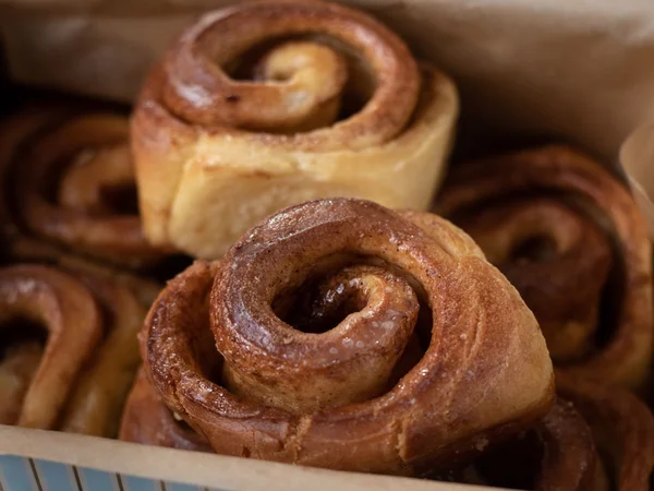 Cinnamon rolls with dark spiced swirls and golden dough